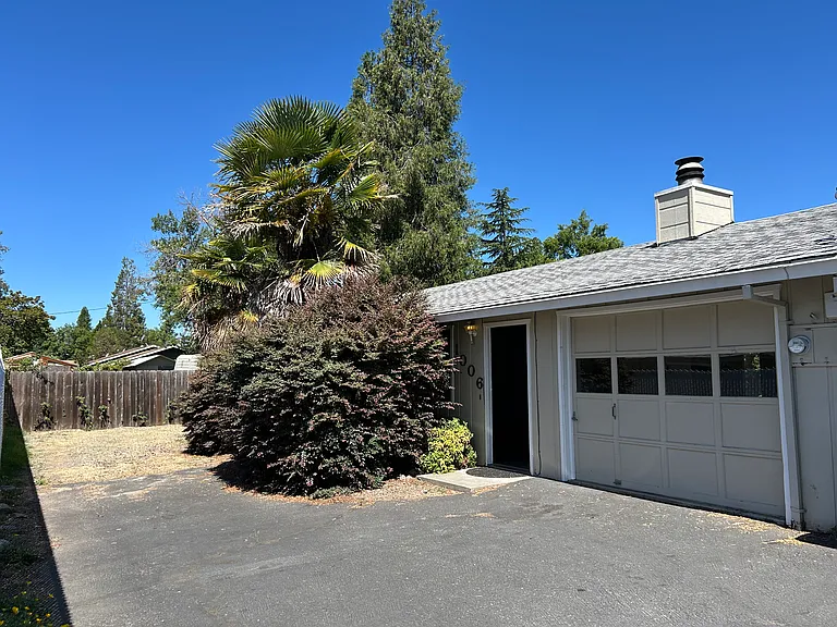 Front of house is set back off the street for privacy ans includes a one car garage and carport