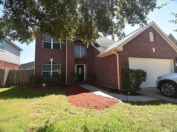 Front with 2 car garage