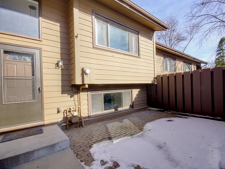 Welcome to 311 W Eagle Lake Dr! Features a private patio courtyard that leads to your own garage.