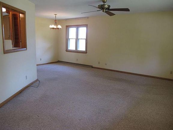 Spacious living room with ceiling fan!