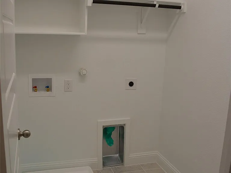 DEDICATED SPACIOUS LAUNDRY ROOM
