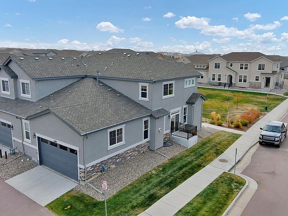 End unit, Garage-side view and guest parking at the street