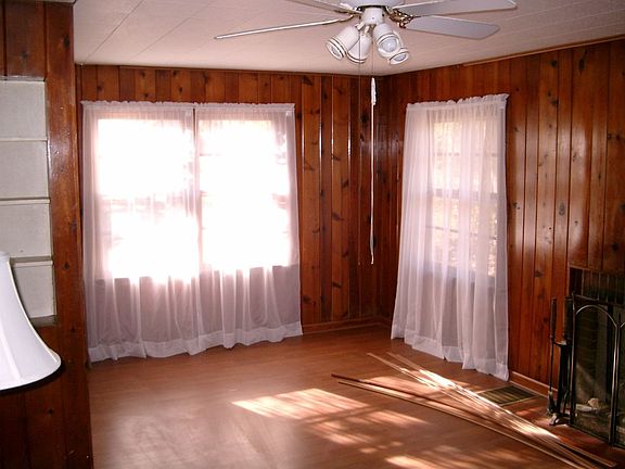 Family room. Floor installed 2006. Wood panelling; wood burning fireplace.