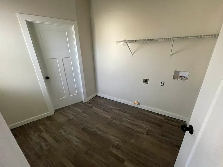 Laundry room, entrance to downstairs half bath