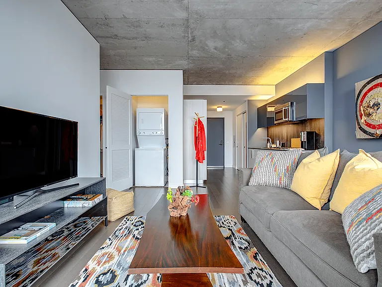 Model apartment living area and kitchen