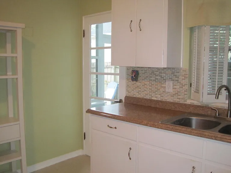 kitchen leading out to sunroom