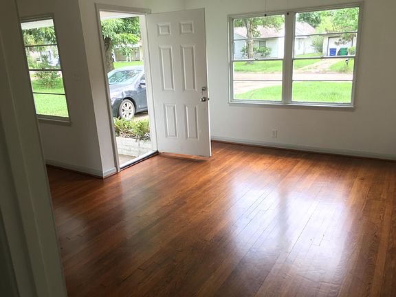 Refinished original hardwood flooring in living room, dining room and hallway.