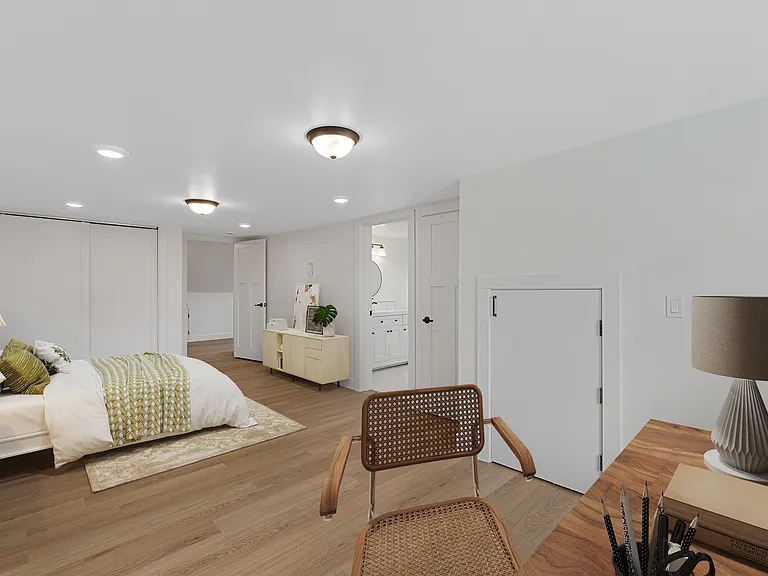 Upper (2nd) primary suite w/ 2 closets and 2 attic rooms. Bay and farmland views from office/seating nook.
