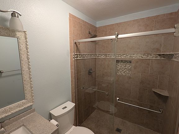 Master bathroom with updated tile and vanity.