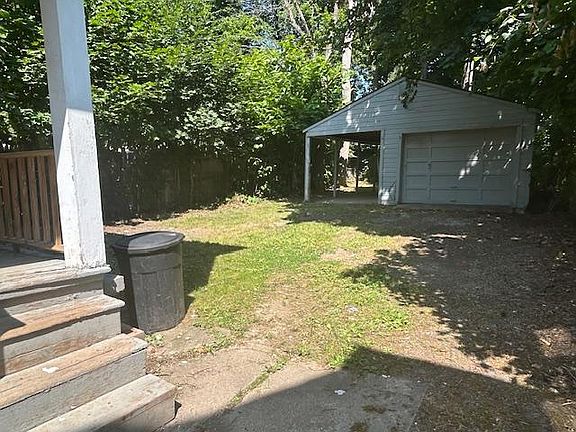 Fenced back yard with garage
