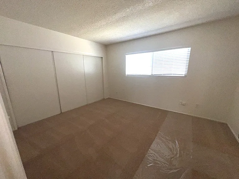 Bedroom with wall to wall closet