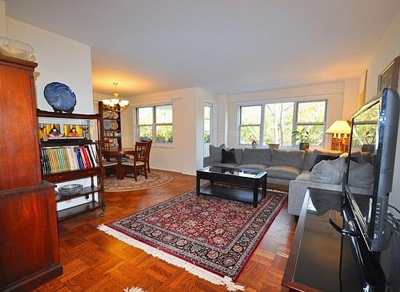 The large living room has a door that leads to a private balcony, great for enjoying the outdoors and opens to a "L" shaped dining room.  The is also a large foyer area great for a home office set up.  The living room is 20'-0" x 12'-0" and the dining roo