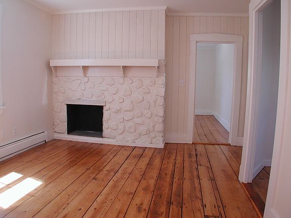 Living room with view into bedroom