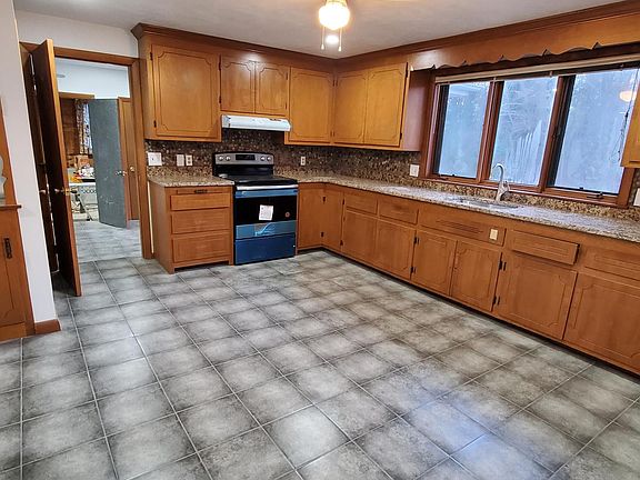 Eat In Kitchen with stainless steel appliances and granite countertops.