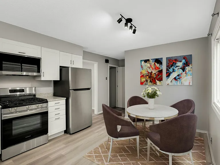 Virtually staged to showcase dining area within the kitchen