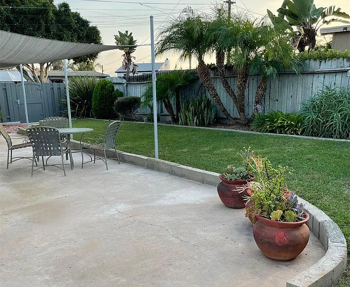 Backyard patio and yard view toward southwest.
Note: new fence installed 6/11/26