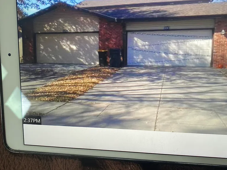 Front exterior showing the duplex with the left side garage at 5543 S 38th St
