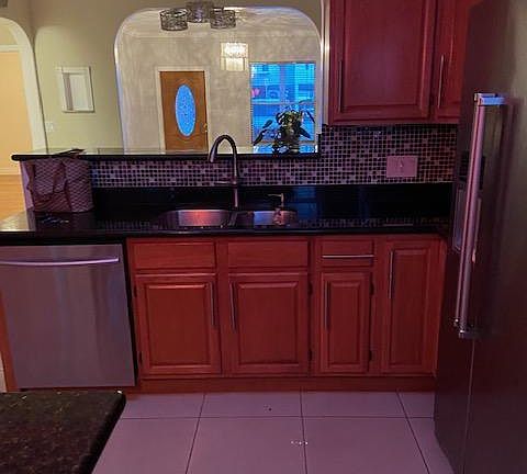 Kitchen and dishwasher. Also wine/bevarage refrigerator not visual on the photo.