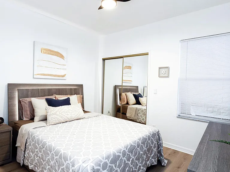 Each bedroom features a queen sized bed, a wall mounted Smart TV, and plenty of closet space.