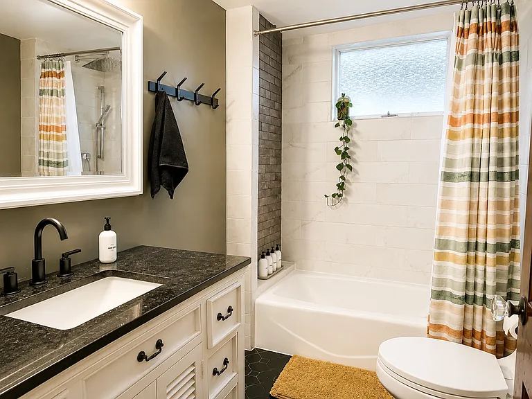 Full bath/shower with granite counter top