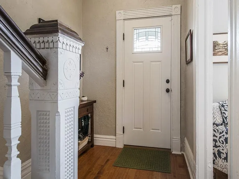 Entry way with hand carved staircase