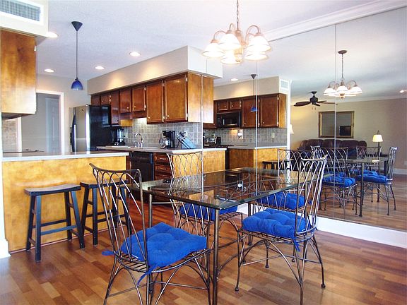Dining area with hardwood floors and awesome lake views.
