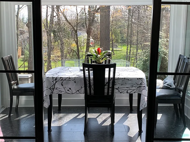 dining room with contemporary glass panel doors partially opened
