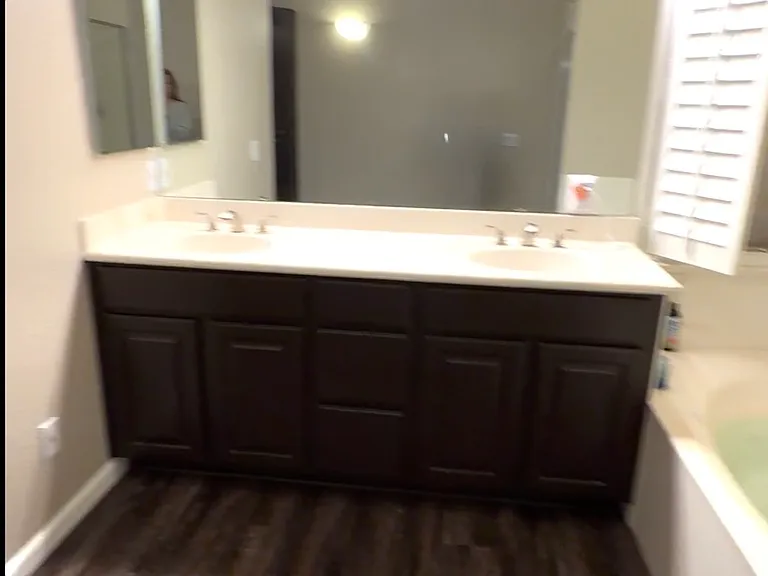 Dual vanity in master bathroom.