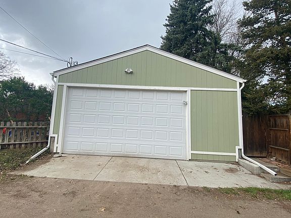 Oversized garage with work bench and storage