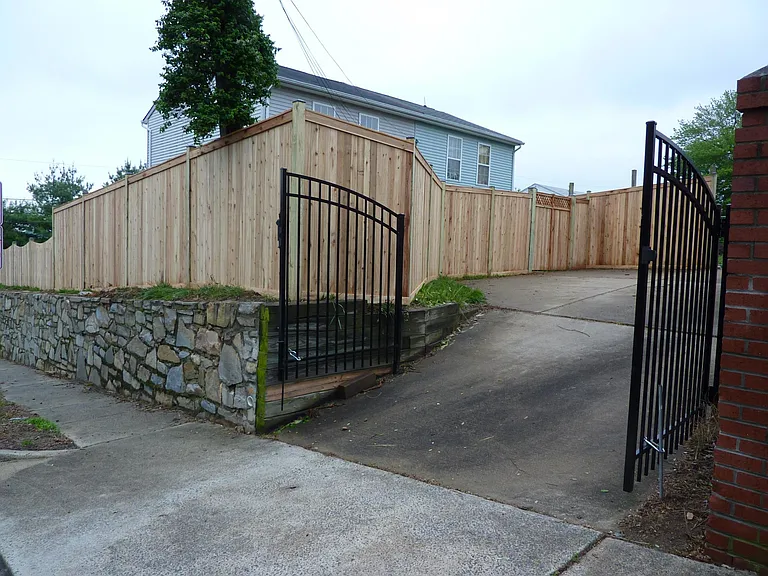 Private, dedicated parking space behind home with driveway