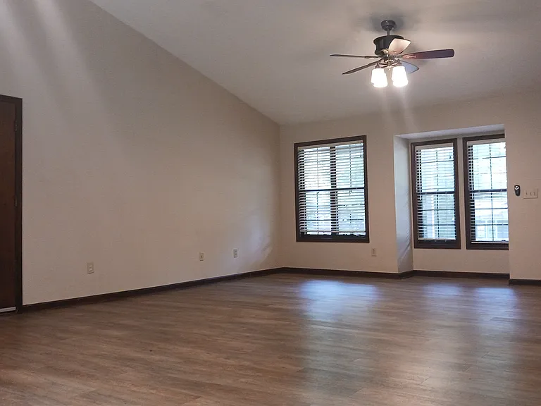 From dining area, view to the front entrance. Left door is entrance to garage