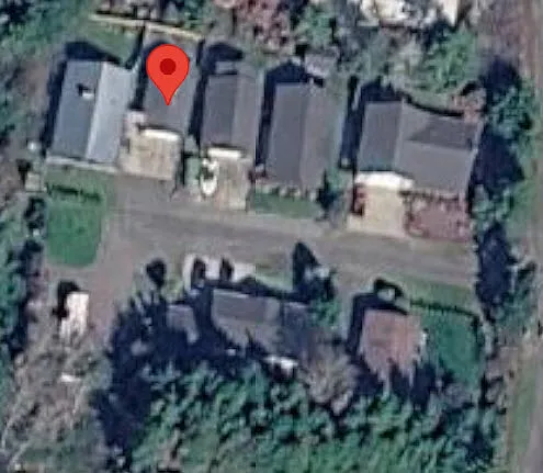 Small quiet cul-de-sac aerial photo. Studio at red arrow, parking in driveway in front