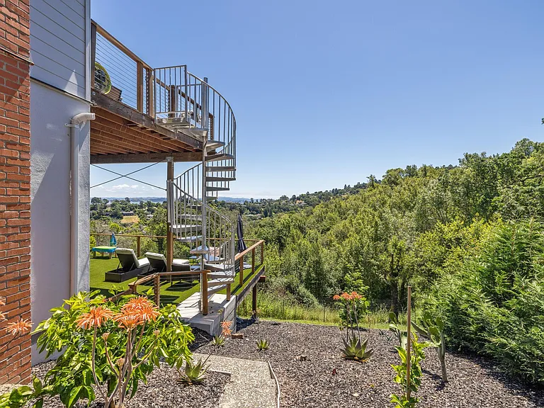 Southeast view from side of house, includes lower and upper decks