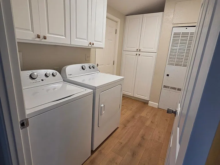 Separate laundry room with extra storage