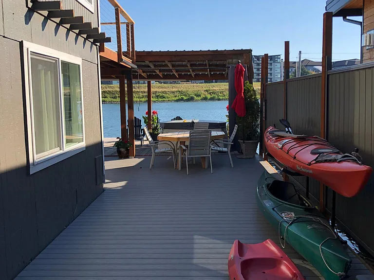 side deck with a couple of Kayaks, tons of deck space for Bikes & ??