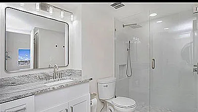 Newly renovated bathroom with rain shower and hand held