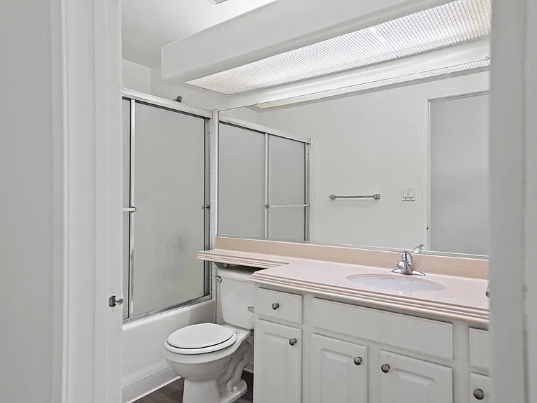 Bathroom with Bathtub and Vanity with Cabinet Storage