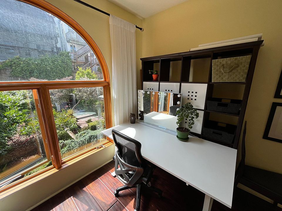 bedroom 2 -one of 2 sun-filled bedrooms with garden view