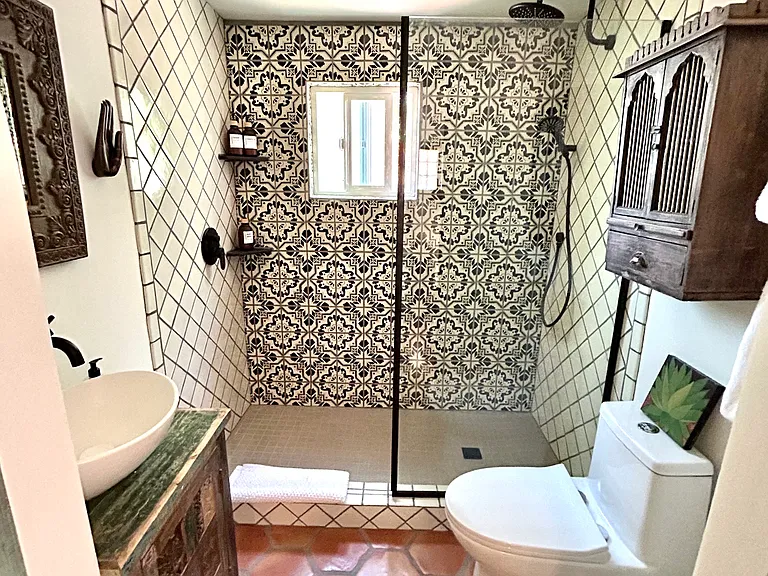 Casita bathroom - heated saltillo floors, hand painted Talavera tiles in the walk-in rain shower