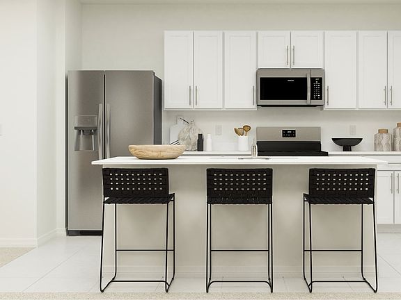 Seamless open floor plan, combining the dining area, modern kitchen, and expansive great room, perfect for entertaining and daily living.