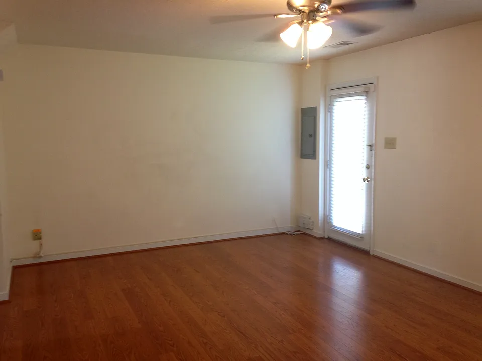 Large living room with wood floors