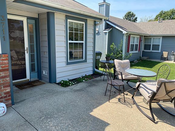 Wonderful sitting area next to flower garden