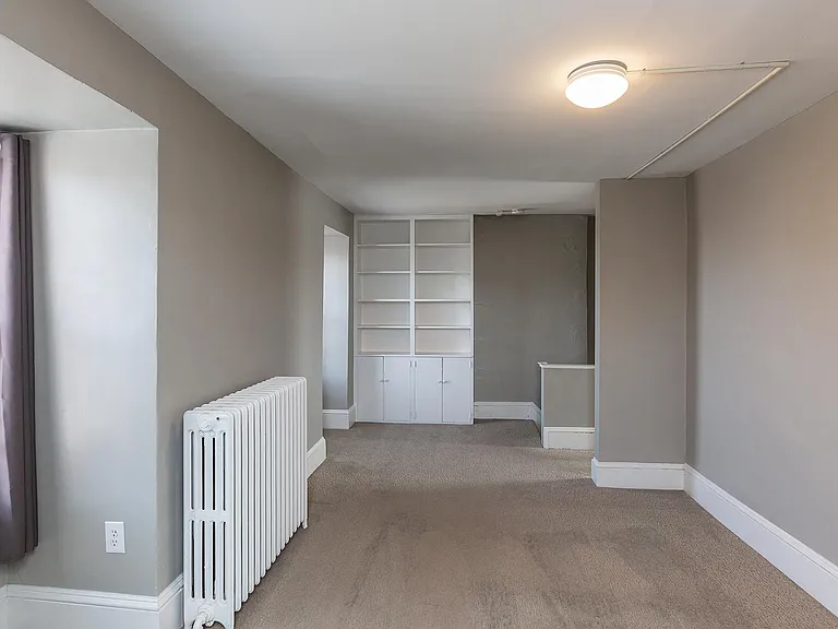 Master bedroom, on third floor, with lots of built-ins and new carpet.