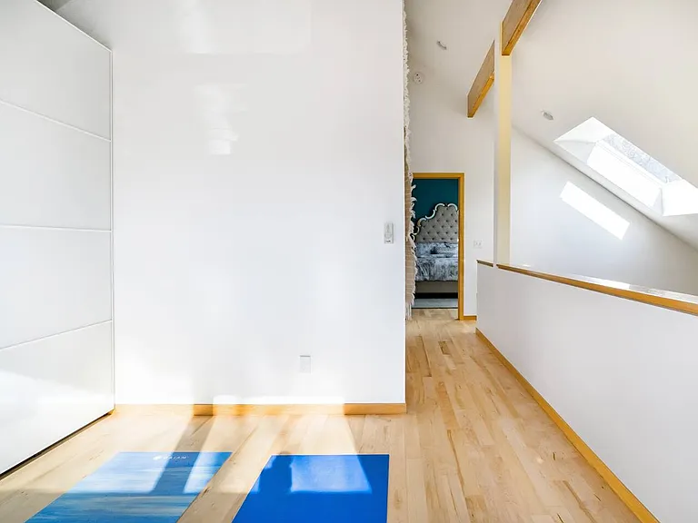 Bright Loft space with large hidden storage area