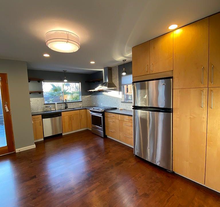 New floors, new backsplash, new appliances, new countertops, and new LED light fixtures and pendants