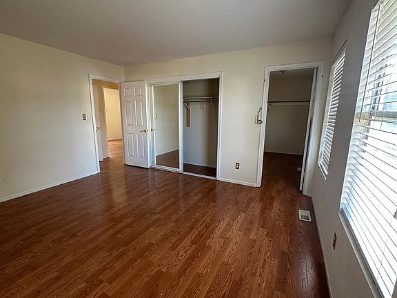 master bedroom with walk in closet