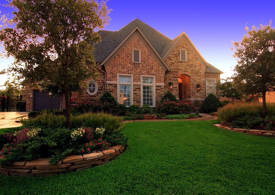 Stunning stone and brick home in the coveted Paloma Point addition of Creekside Village. Three car garage.