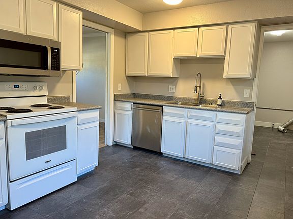 Kitchen; view of laundry room down to the right.