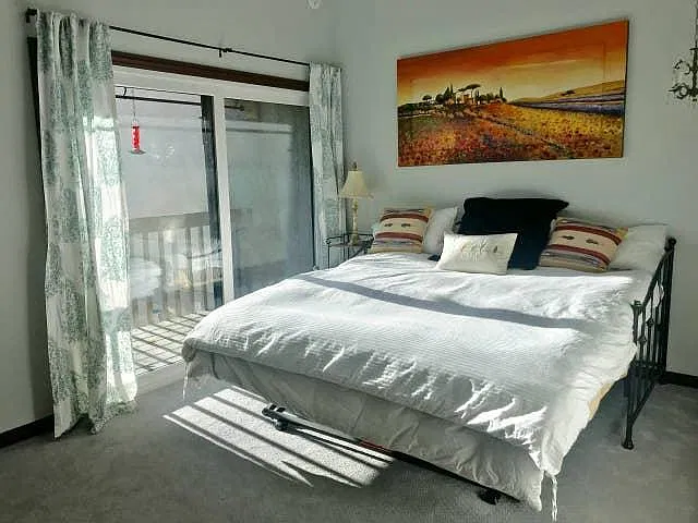 Second Story Bedroom with a Trundle Bed that goes from a Twin to a King Bed and a balcony with views of Park City Mountain Resort.