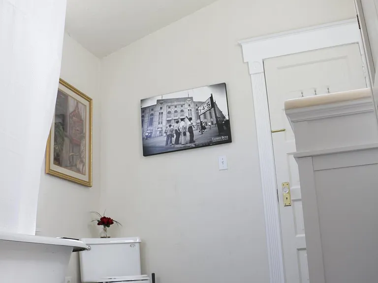 View of bathroom showing tub, toilet, vanity and VeLux skylight (and some art) :)